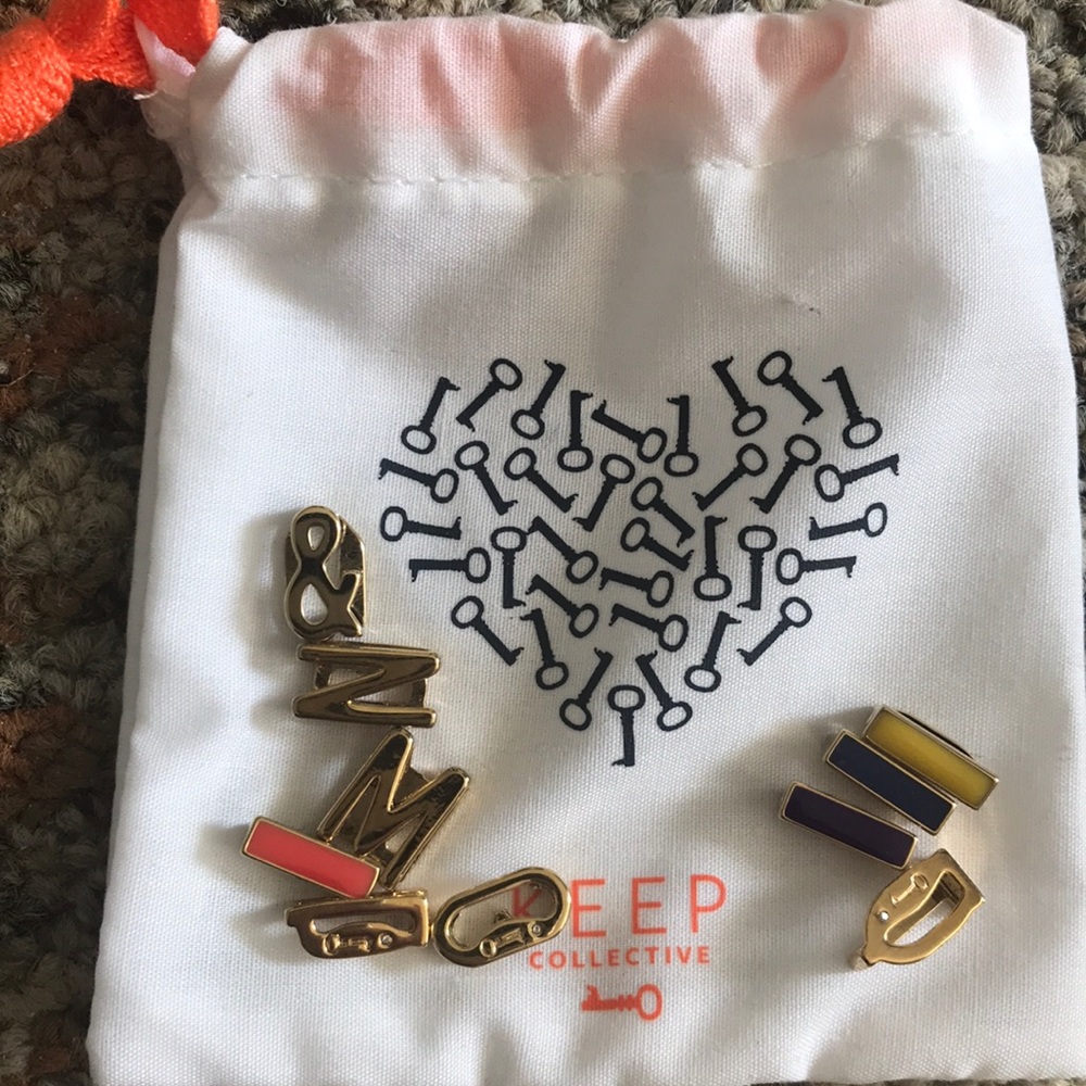 Assorted NEW Gold Charms from KEEP with bag.